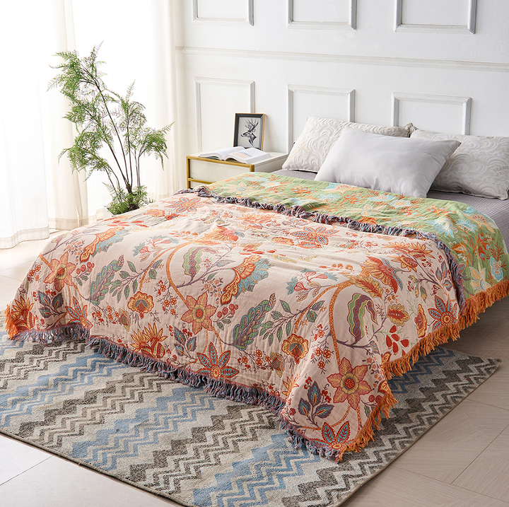 Bohemian style cotton blanket featuring a unique rustic floral design, ideal as a decorative throw.