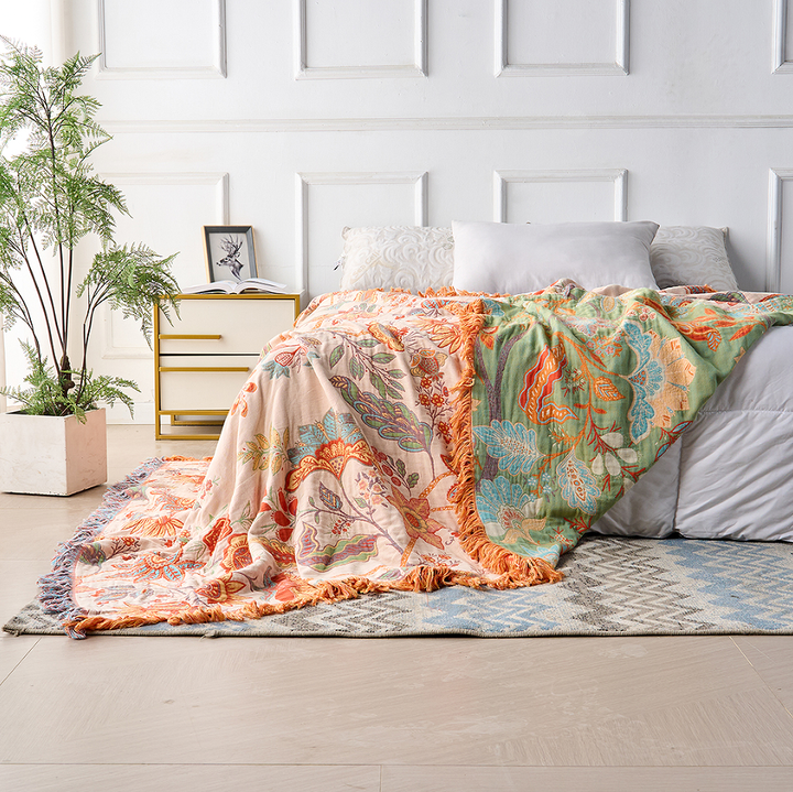Cozy rustic floral boho blanket made from soft cotton, adding a touch of bohemian decor.