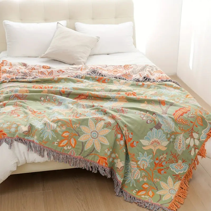 Elegant bohemian cotton blanket with a rustic floral motif, an inviting and cozy throw.