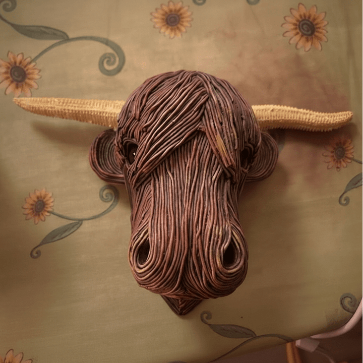 Decorative resin Highland Cow wall sculpture, featuring a rustic finish. Ideal farmhouse style animal art for home decor.