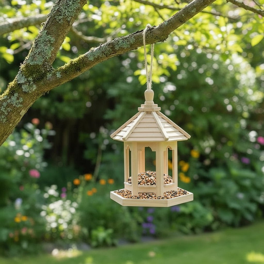Close-up of a rustic wooden birdhouse and bird feeder with water basin. Natural wood garden decor for outdoor patios.
