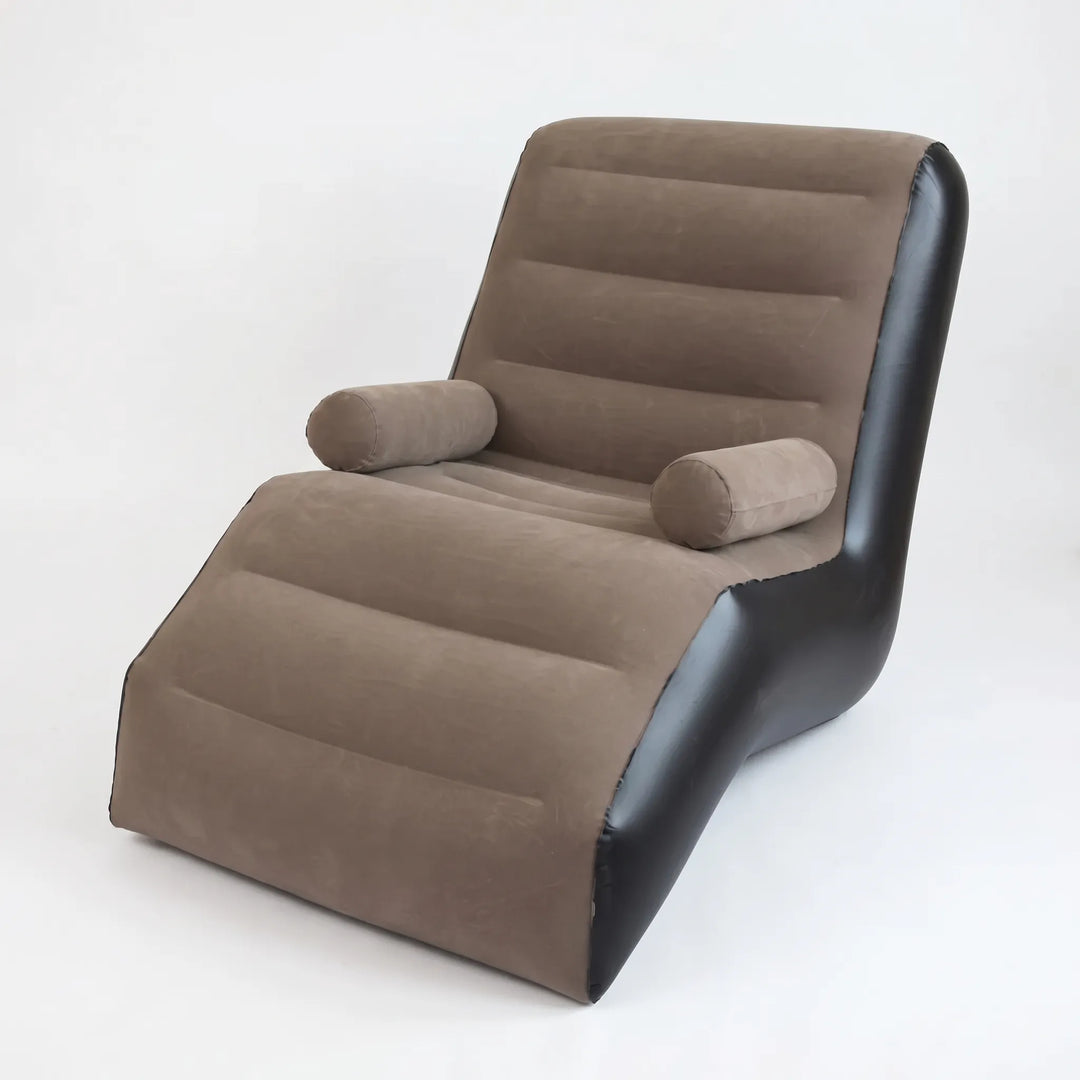 Pink S-shaped inflatable lounger for ultimate comfort. Portable air chaise longue sofa for indoor/outdoor relaxation.