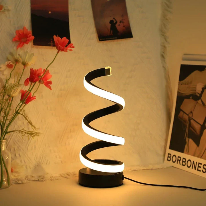 Sleek S-shaped LED lamp, FlexiGlow, brings modern lighting to any desk. USB-powered office lamp, ideal for contemporary decor.