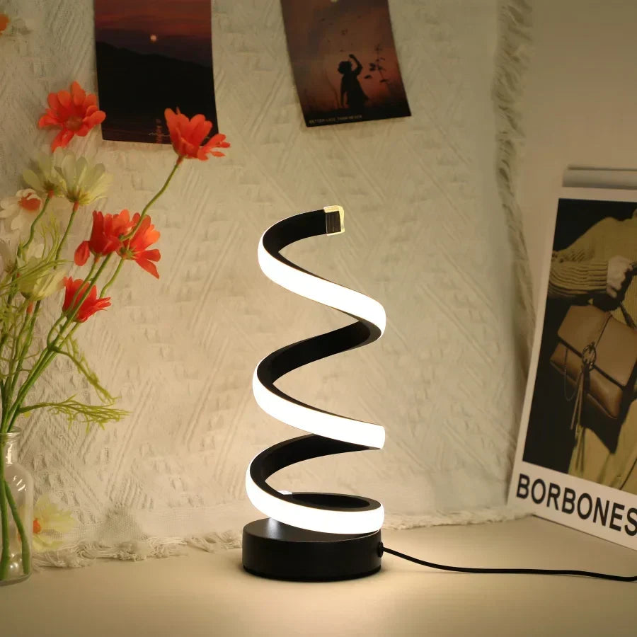 Contemporary S-shaped LED desk lamp, FlexiGlow, for modern workspace decor. Energy-efficient, USB-powered office lighting.