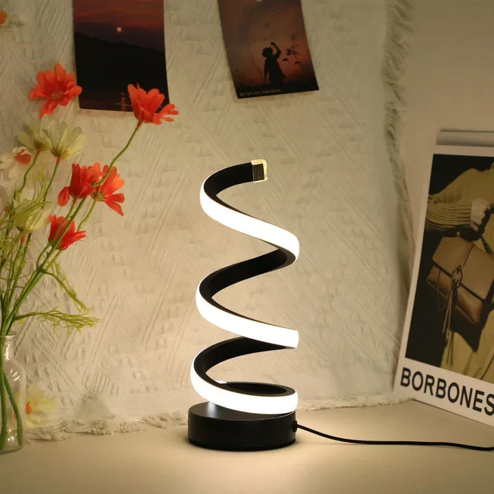 Contemporary S-shaped LED desk lamp, FlexiGlow, for modern workspace decor. Energy-efficient, USB-powered office lighting.