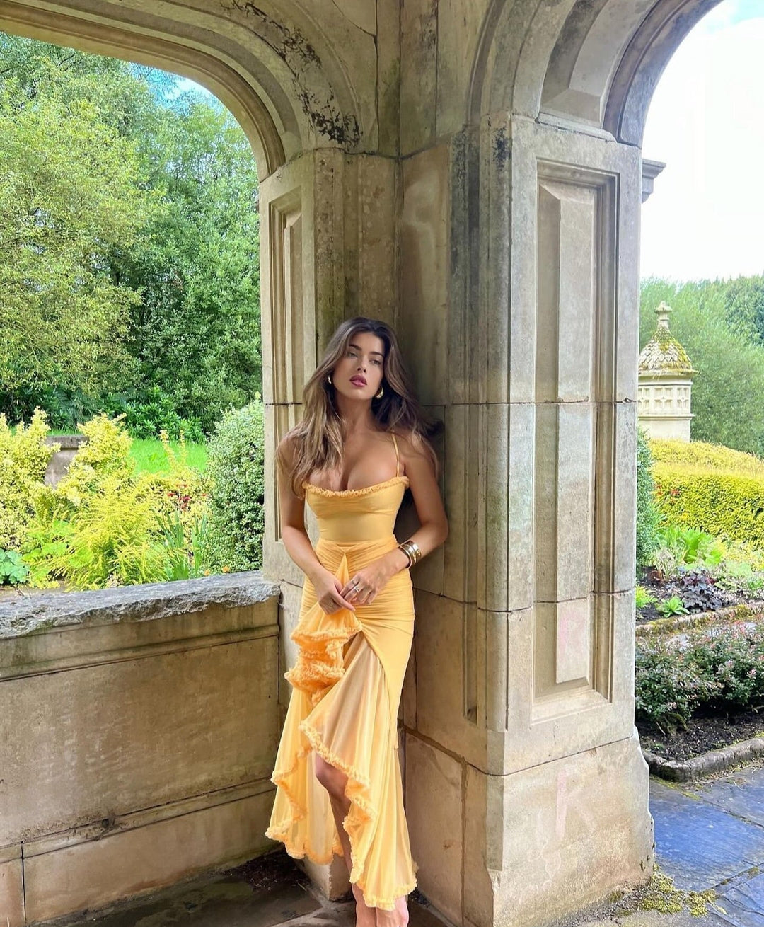 Elegant Saffron Sleeveless Ruffle Maxi Dress, perfect as a formal wedding guest dress.