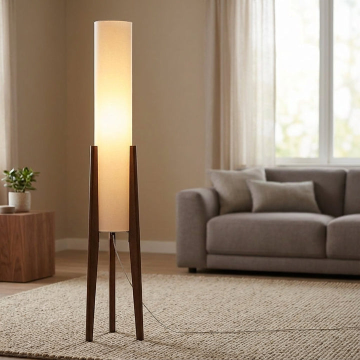 Scandinavian ambient floor lamp with walnut wood base for cozy living room decor.
