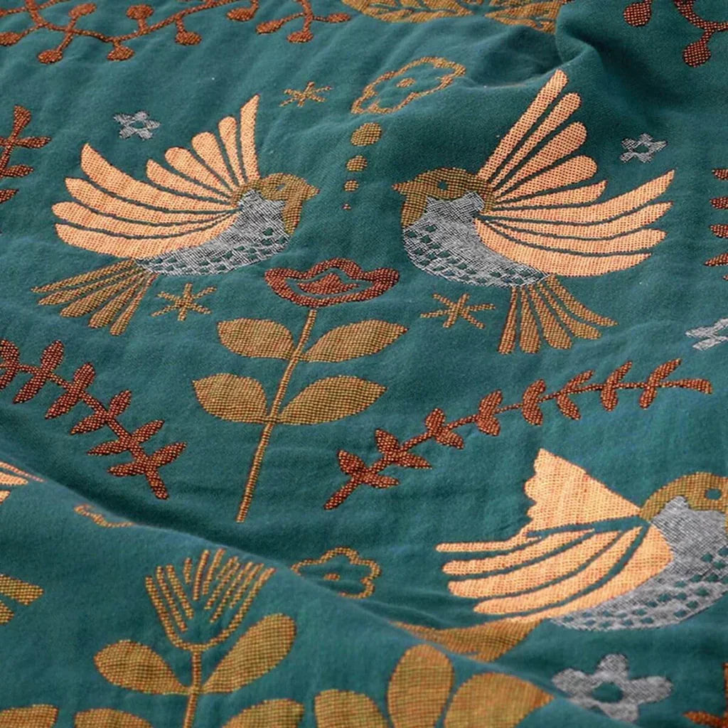 Cozy reversible Scandinavian bird throw blanket, ideal living room & bedroom accent.