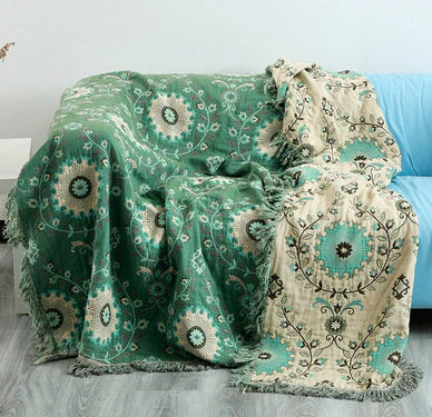 Elegant & versatile reversible Scandinavian bird blanket, cozy cotton throw for sophisticated home decor.