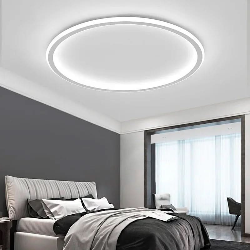 Minimalist Scandinavian LED ceiling light. Delivers soft, ambient light, perfect for modern living room & bedroom.