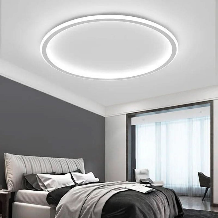 Minimalist Scandinavian LED ceiling light. Delivers soft, ambient light, perfect for modern living room & bedroom.