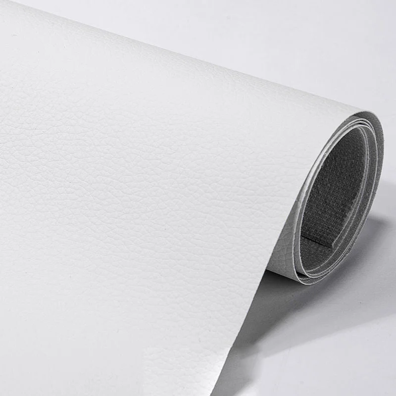 Automotive interior leather repair patch, self-adhesive & cuttable. Ideal for car seats & panels.
