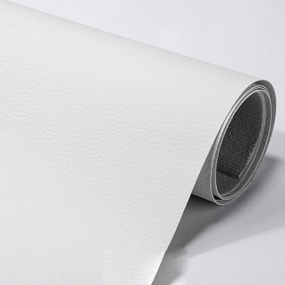 Automotive interior leather repair patch, self-adhesive & cuttable. Ideal for car seats & panels.