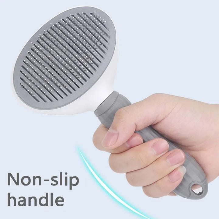 Hand demonstrates the self-cleaning pet brush feature. Easy fur removal for dogs & cats. Pet care essential.