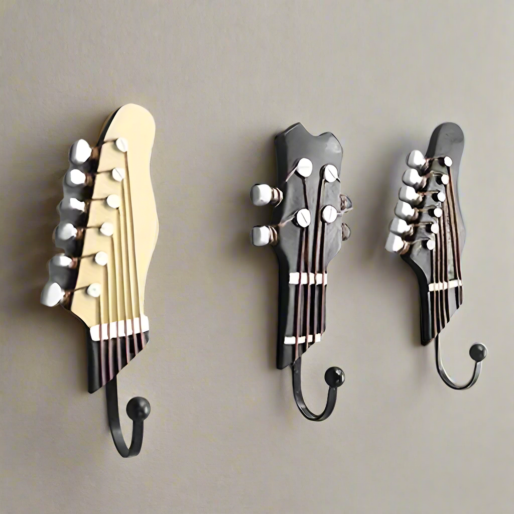 Set of 3 decorative guitar wall hooks for home organization & unique musical decor.