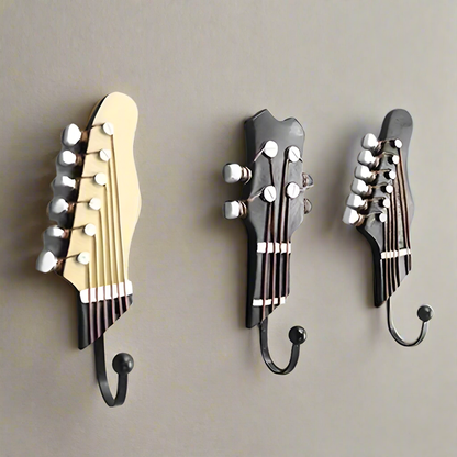 Set of 3 decorative guitar wall hooks for home organization & unique musical decor.