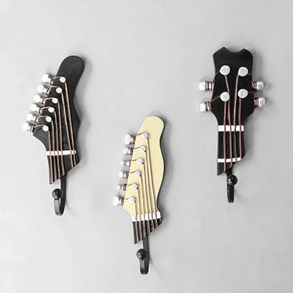 Elegant decorative guitar wall hooks, a set of 3, ideal for adding a musical touch to any room's wall decor.