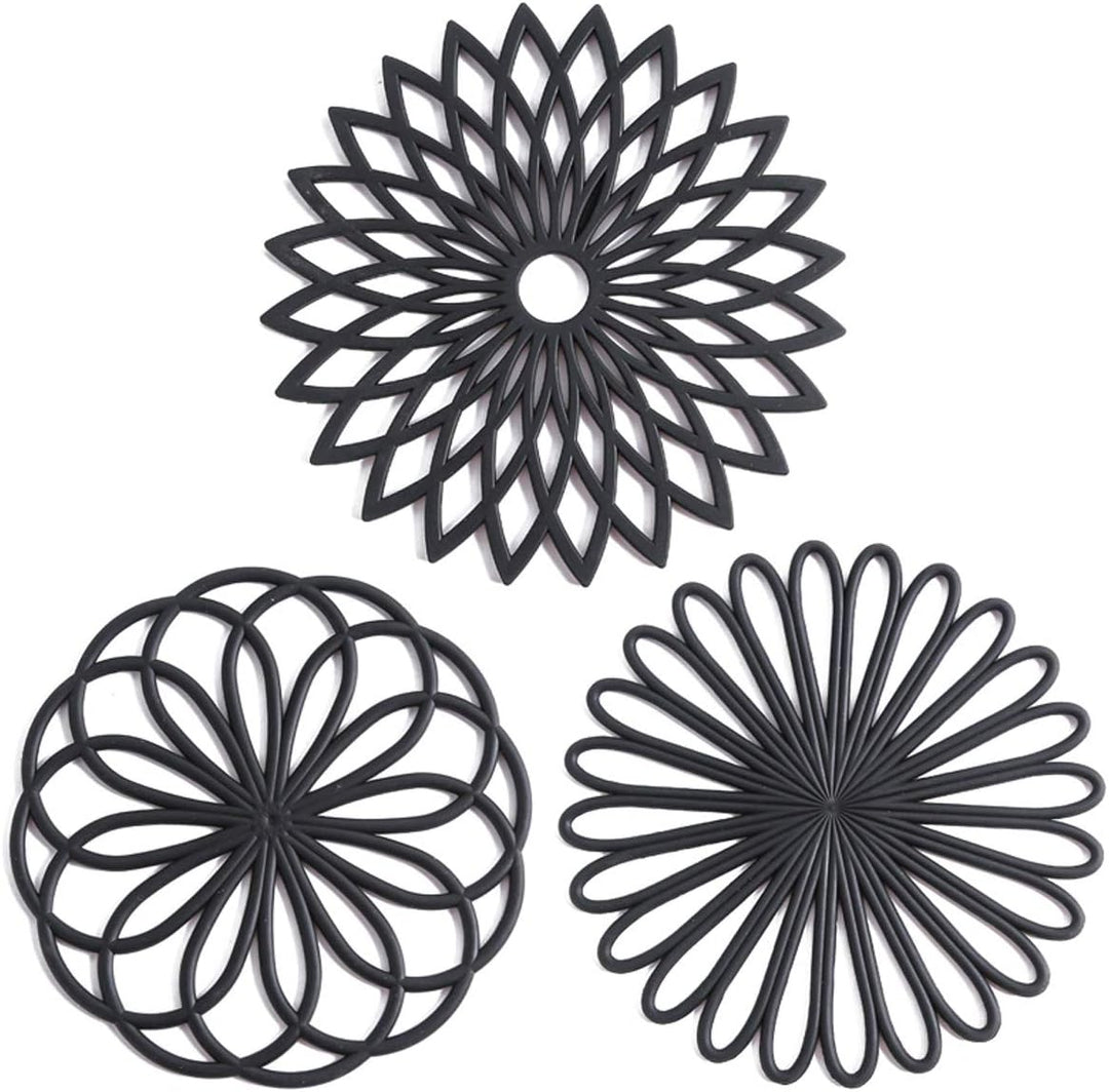 Set of 3 silicone coasters, heat resistant trivets for table protection.