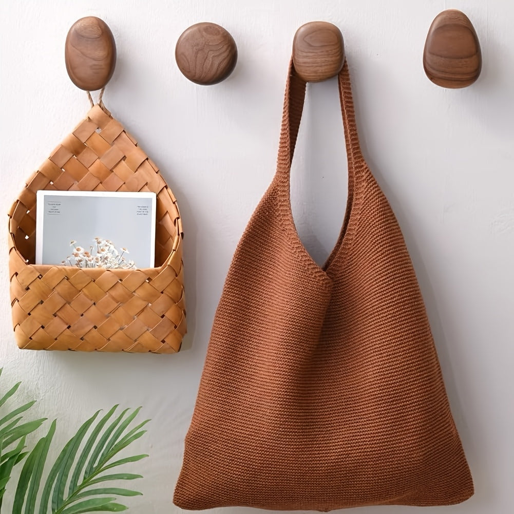 Set of 4 organic pebble wooden wall hooks, natural solid wood for entryway & home organization.