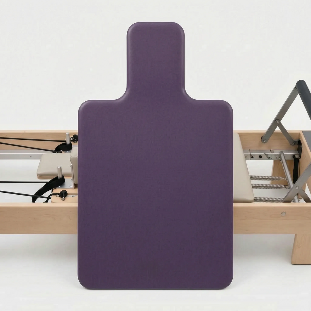 Essential shaped Pilates reformer pad accessory for studio. Non-slip surface ensures secure, comfortable workouts.