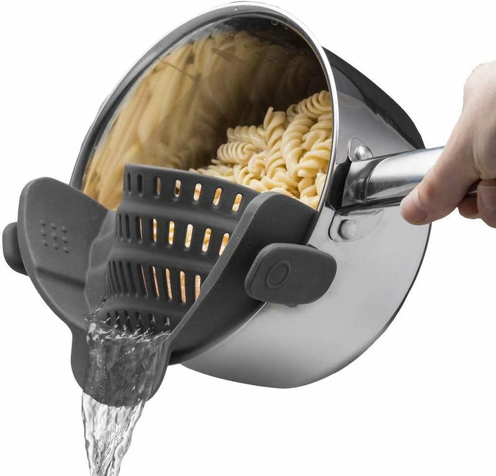 Silicone clip-on strainer for pasta & vegetables, heat-resistant, space-saving kitchen tool.