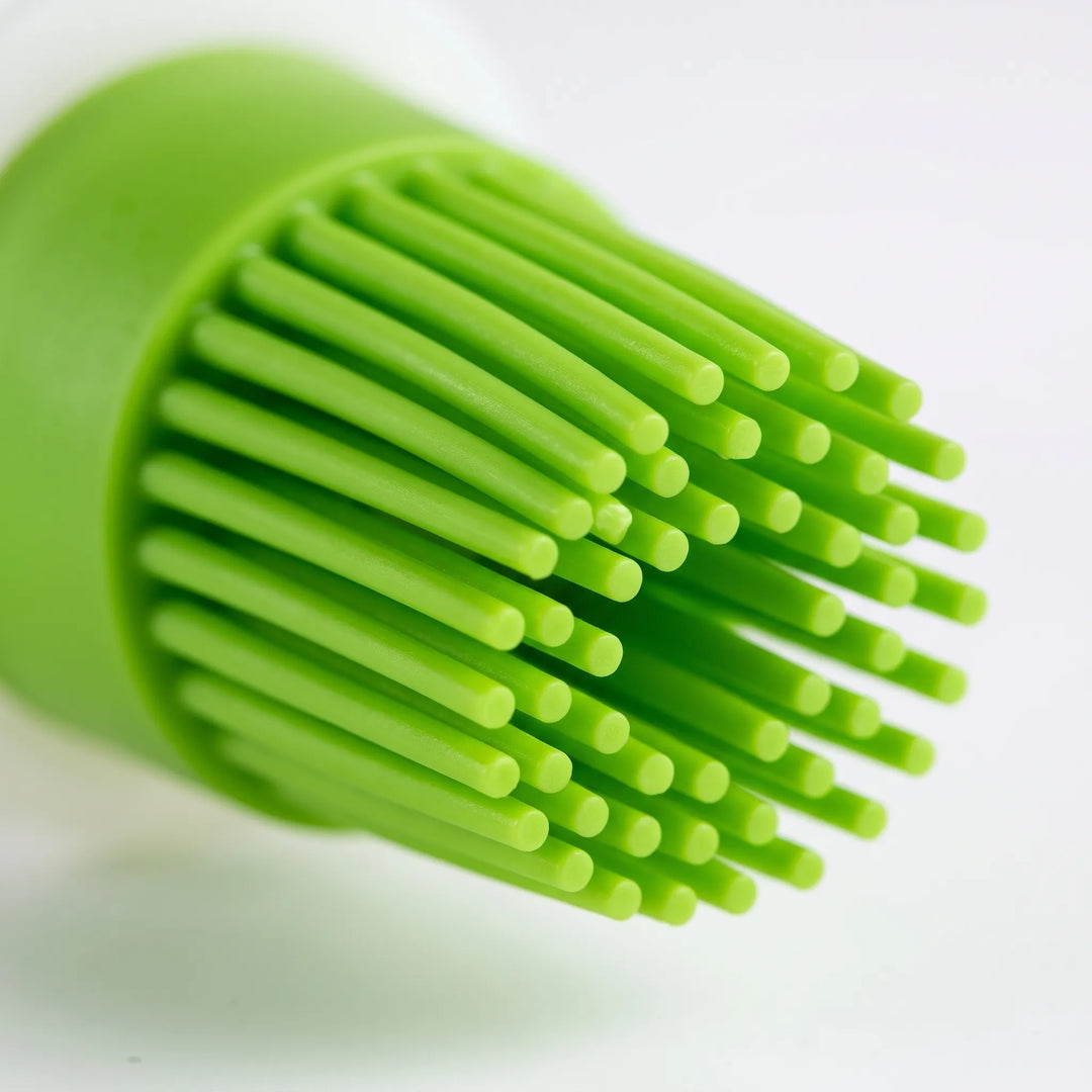 Innovative silicone basting & pastry brush, a kitchen gadget with built-in oil dispenser for cooking.