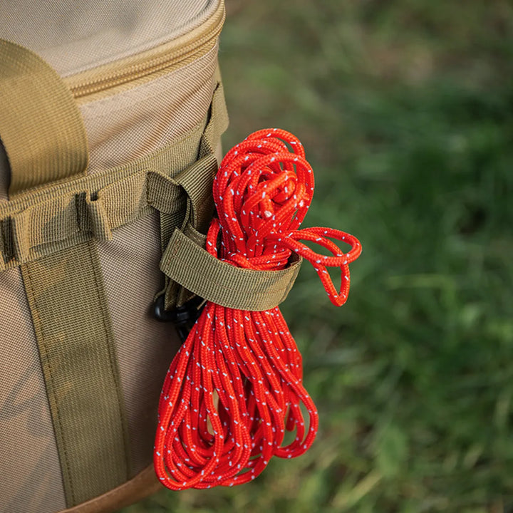 Tactical glove holder clips neatly organized on a pegboard, ready for any outdoor adventure or emergency.