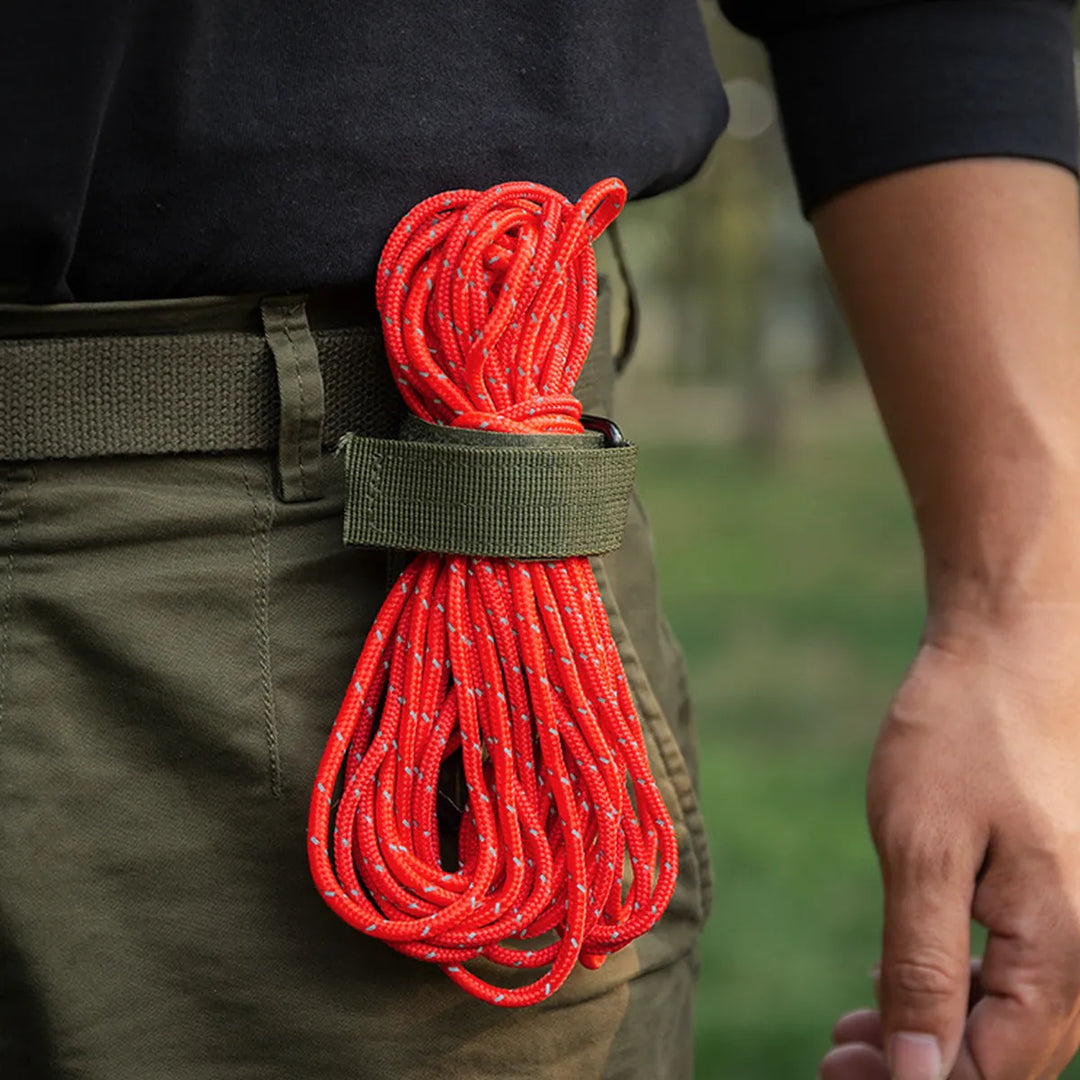 Detailed view of the tactical glove holder clip's secure locking mechanism, an essential camping gear accessory.