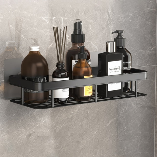 Sleek black metal suction shower caddy for organized bathroom storage, no drilling needed.