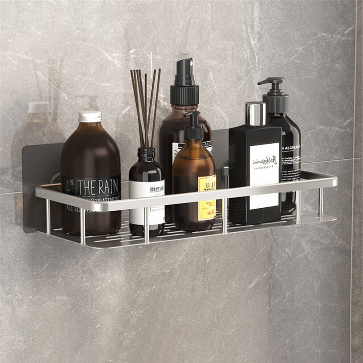 Modern silver suction cup shower caddy, rust-resistant metal for elegant bathroom storage.