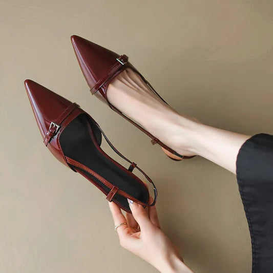 Sleek black pointed toe kitten heels for women, perfect for office or evening wear.
