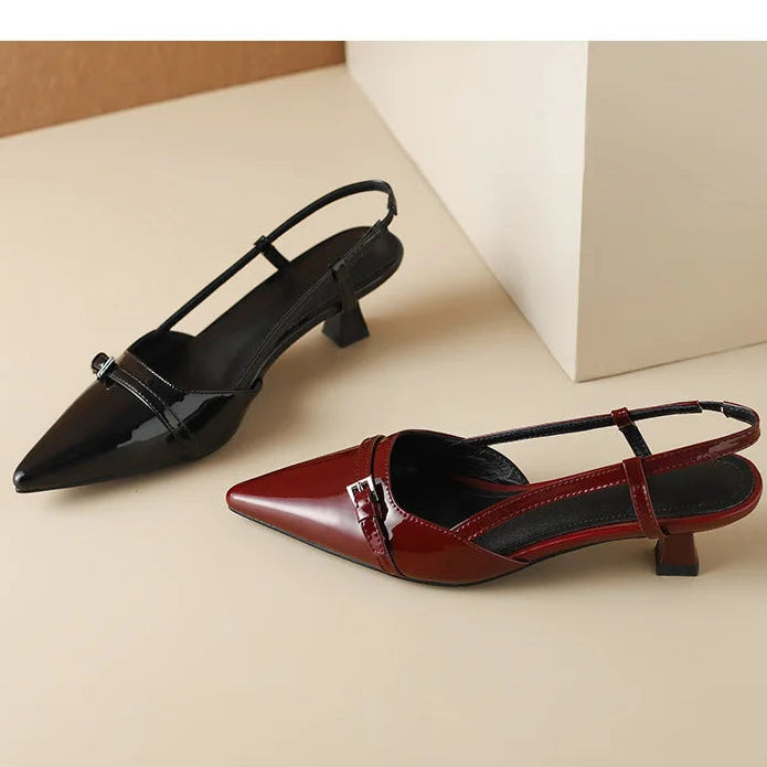 Elegant black pointed toe kitten heels, women's slingback shoes for sophisticated style.