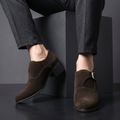 Stylish black men's slip-on loafers, perfect dress shoes for formal events or elegant casual outfits.