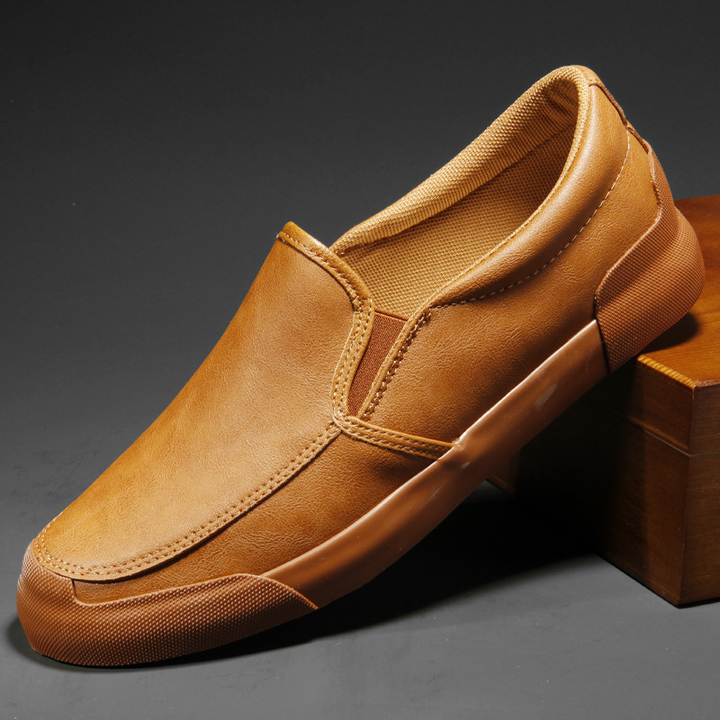 Sleek men's Chelsea slip-on sneakers for effortless modern everyday style and comfort.