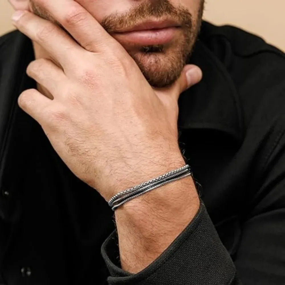 Adjustable men's steel bracelet in sleek silver or black. Durable, sweatproof, anti-scratch everyday wear jewelry.