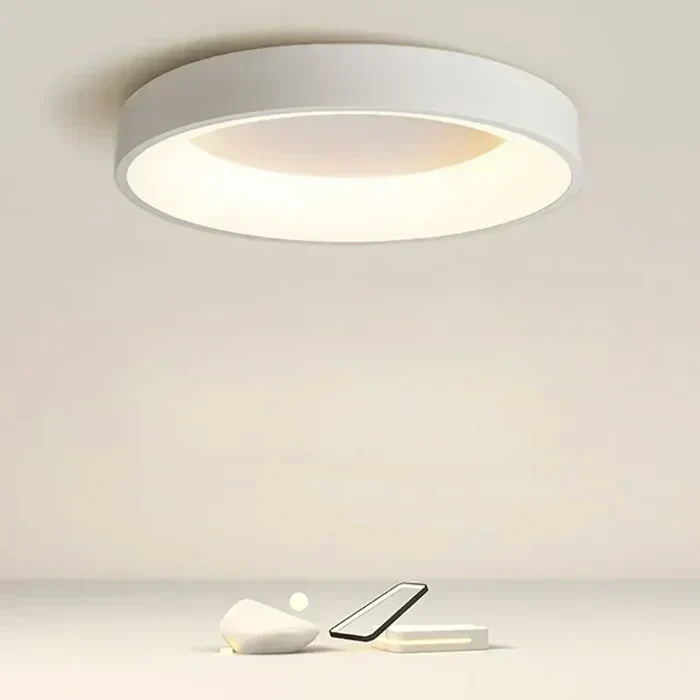 Sleek round LED ceiling light, perfect for modern Scandinavian interiors. Energy-efficient flush mount lamp.