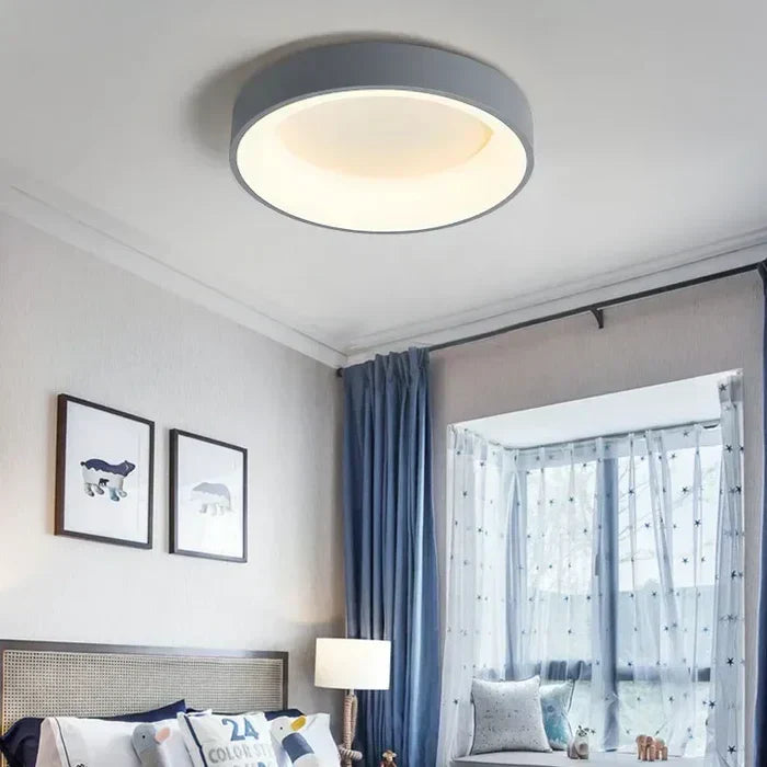 Minimalist NordicGlow round LED ceiling light for bedroom or living room. Modern, energy-efficient home illumination.
