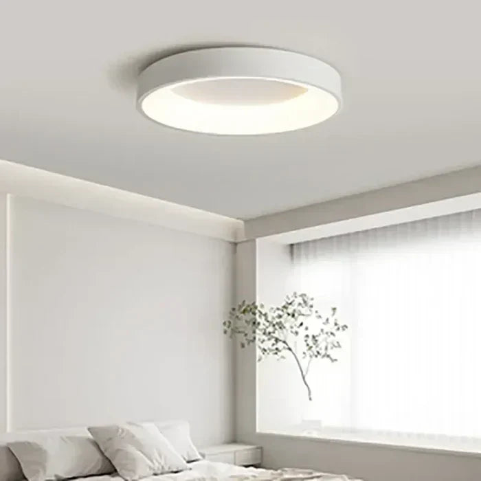 Scandinavian round LED ceiling light, flush mount design. Bright, energy-efficient lighting for modern interiors.