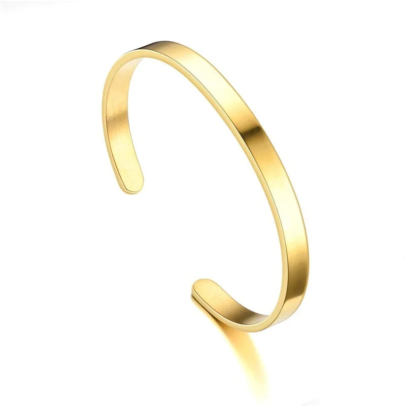 Adjustable gold stainless steel minimalist cuff bracelet, a versatile unisex jewelry piece.