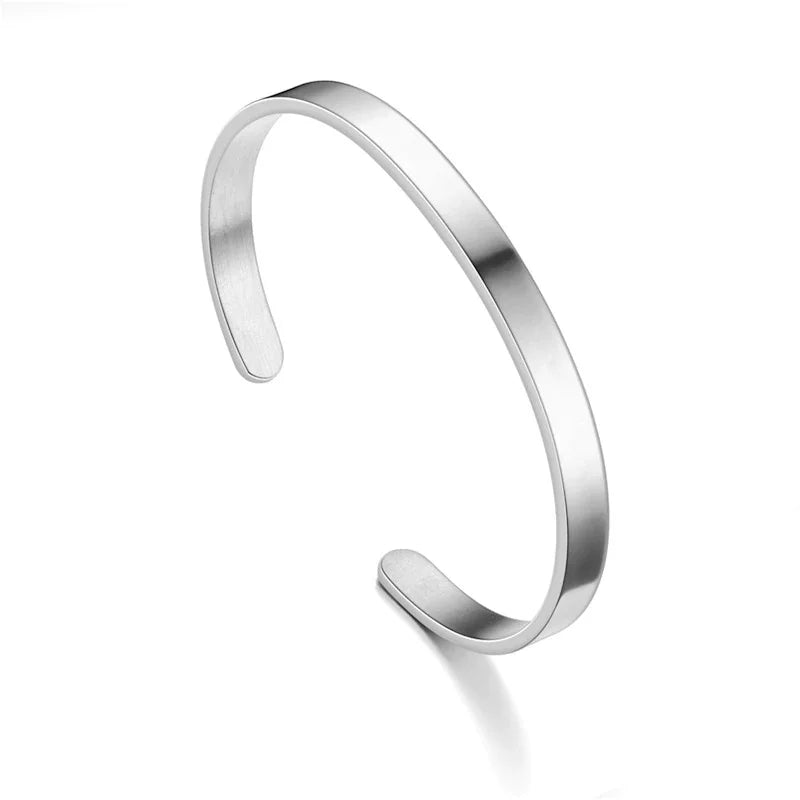 Silver stainless steel cuff bracelet, adjustable and minimalist. A perfect unisex jewelry accessory.