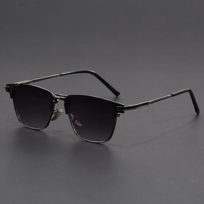 Stylish black square sunglasses, unisex. Sleek frames with subtle metal accents offer UV protection.