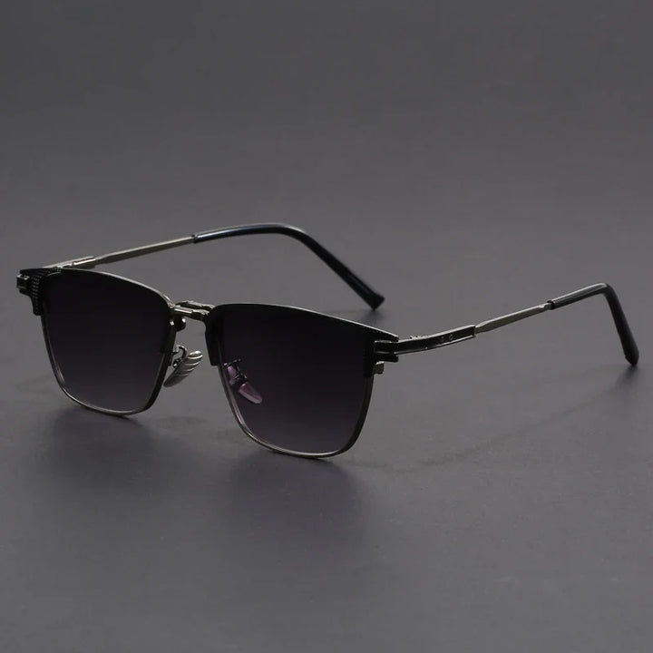 Stylish black square sunglasses, unisex. Sleek frames with subtle metal accents offer UV protection.