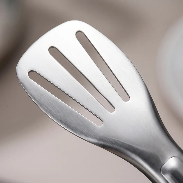 Ergonomic stainless steel slotted tongs, ideal for flipping, grabbing, and draining food during cooking & BBQ.