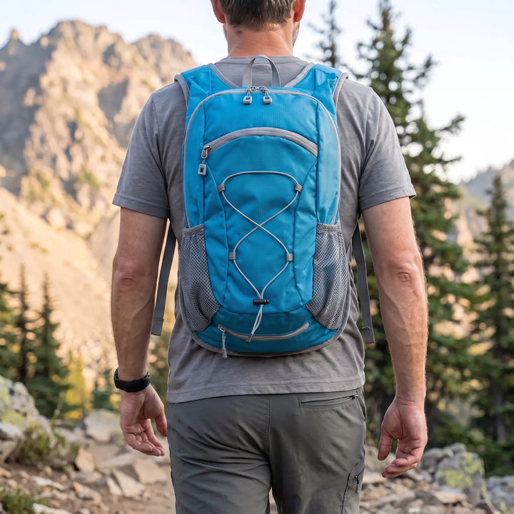 Small black tactical backpack for outdoor hiking and camping adventures. Durable military rucksack gear.