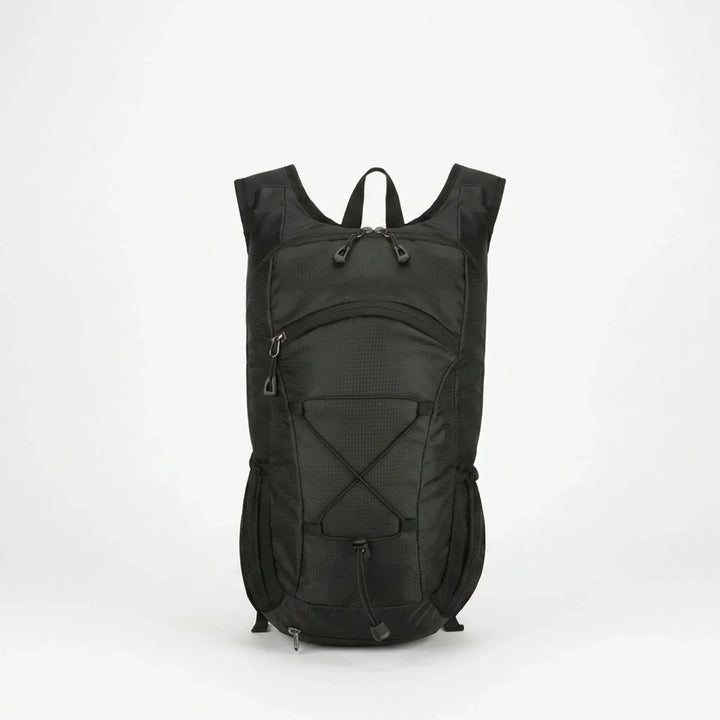 Compact tactical backpack in an outdoor adventure setting, ideal for hiking, camping, and travel gear.