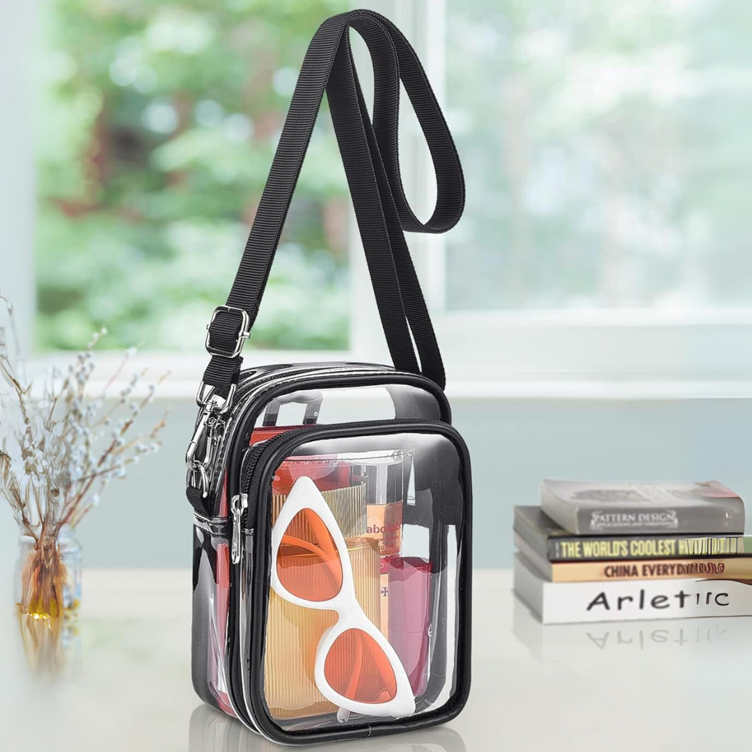 Women's clear transparent crossbody handbag, a small PVC purse featuring an adjustable and removable strap.
