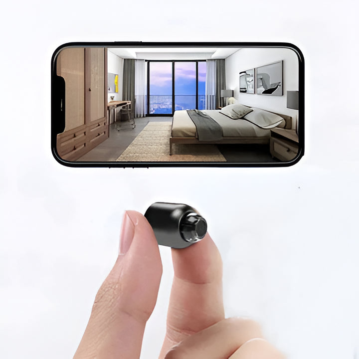 Small WiFi camera with night vision for discreet home security.