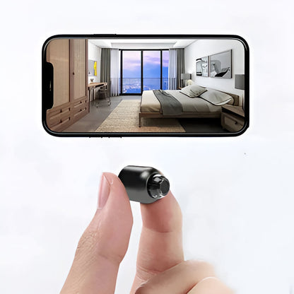 Small WiFi camera with night vision for discreet home security.