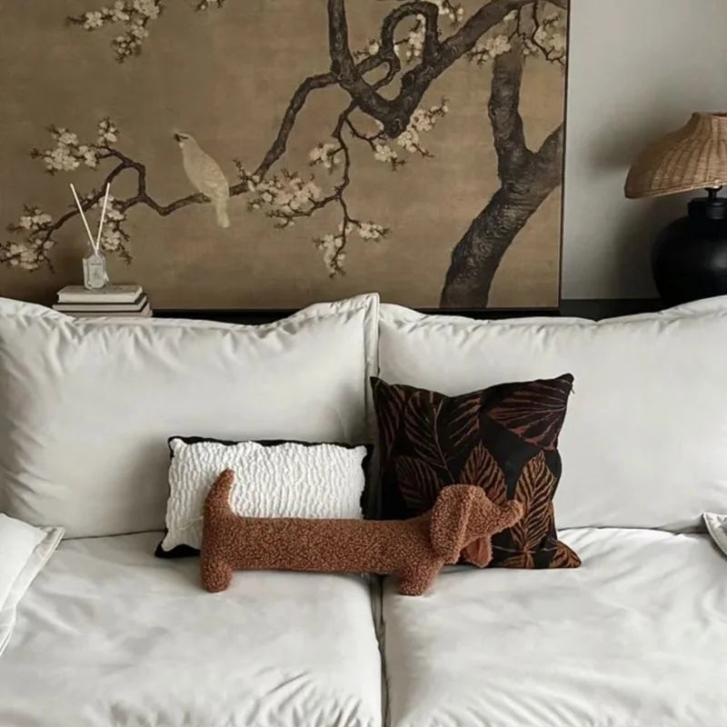 Accent brown Dachshund plush pillow. Soft animal-shaped home decor cushion for cozy spaces.