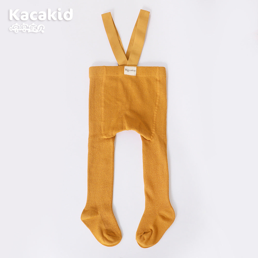 Close-up of soft knitted texture on unisex high-waist baby trousers, showcasing quality.